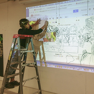 Student Preparing Art with Projector