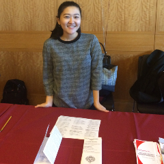 Student standing at Disability Studies Information Table.