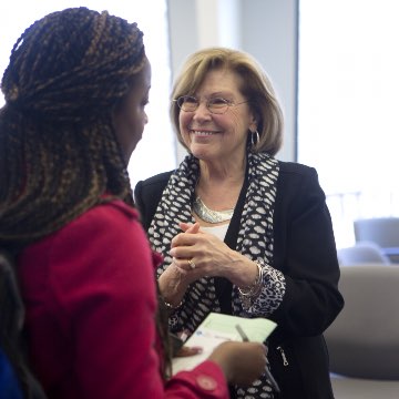 Student speaking with a professor.