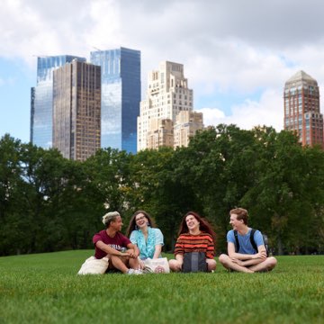 Students sitting in Central Park.