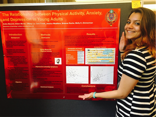 girl in front of scientific poster on depression, anxiety, and physical activity