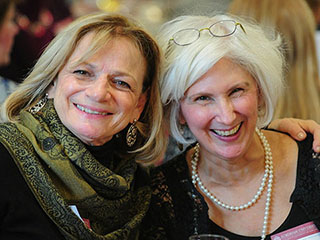 Two Women Smiling at Event