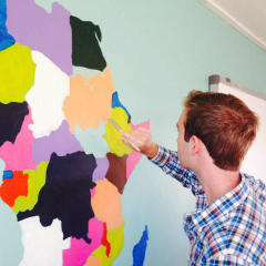 Student Canton Winer paints map of Africa on classroom wall in South Africa