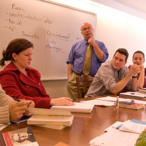 Faculty member in front of white board - LG