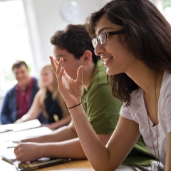 Female Student Making a Point