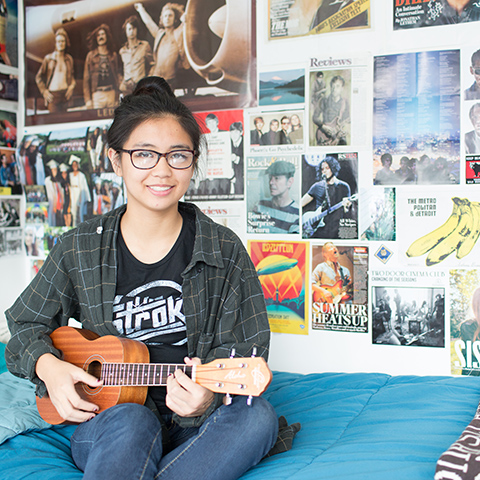 LC girl on dorm bed 