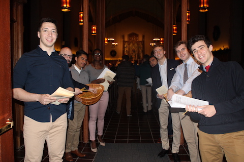 Students welcoming people to the University Church