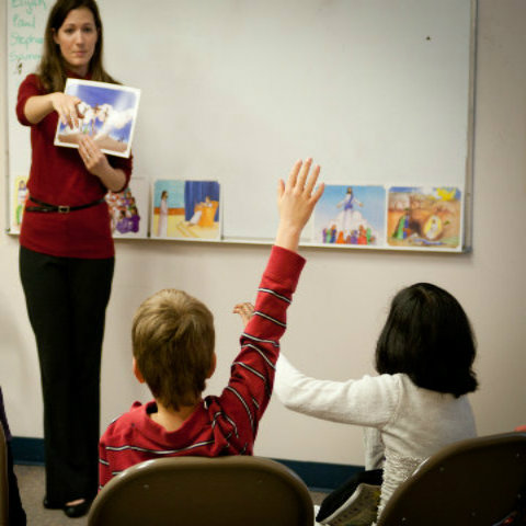 woman teaching in school, grad religion