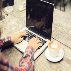 Person Typing on Computer