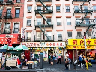 People walking by stores in Chinatown